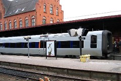 The "Øresundstog" trainset photographed in Helsingør 23. February 2005 . The trainset is built by Adtranz, Sweden (Bombardier Transportation). It is purchased in corporation between SJ, Sweden and DSB, Denmark. The trainsets are in operation between Sjælland in Denmark and southern Sweden via the bridge over Øresund. Each unit consists of 3 coaches. The trainsets was put in service in 2000 - 2003. Electric. 2.120 kW. Max speed 180 km/h - 112 mph. Length 78 900 mm. Weight 153 metric tonnes. 20 seats 1st class, 217 seats 2nd class. Up to 5 trainsets can be put together.